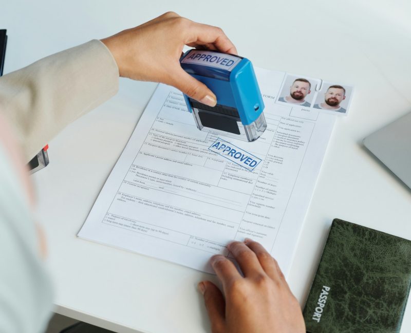 Putting Stamp On Visa Application Form